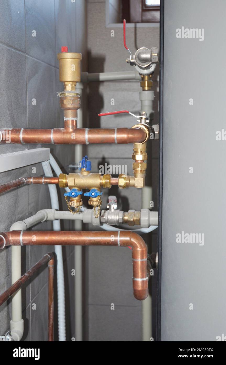 Copper pipes heating system. House heating system copper pipes. Copper