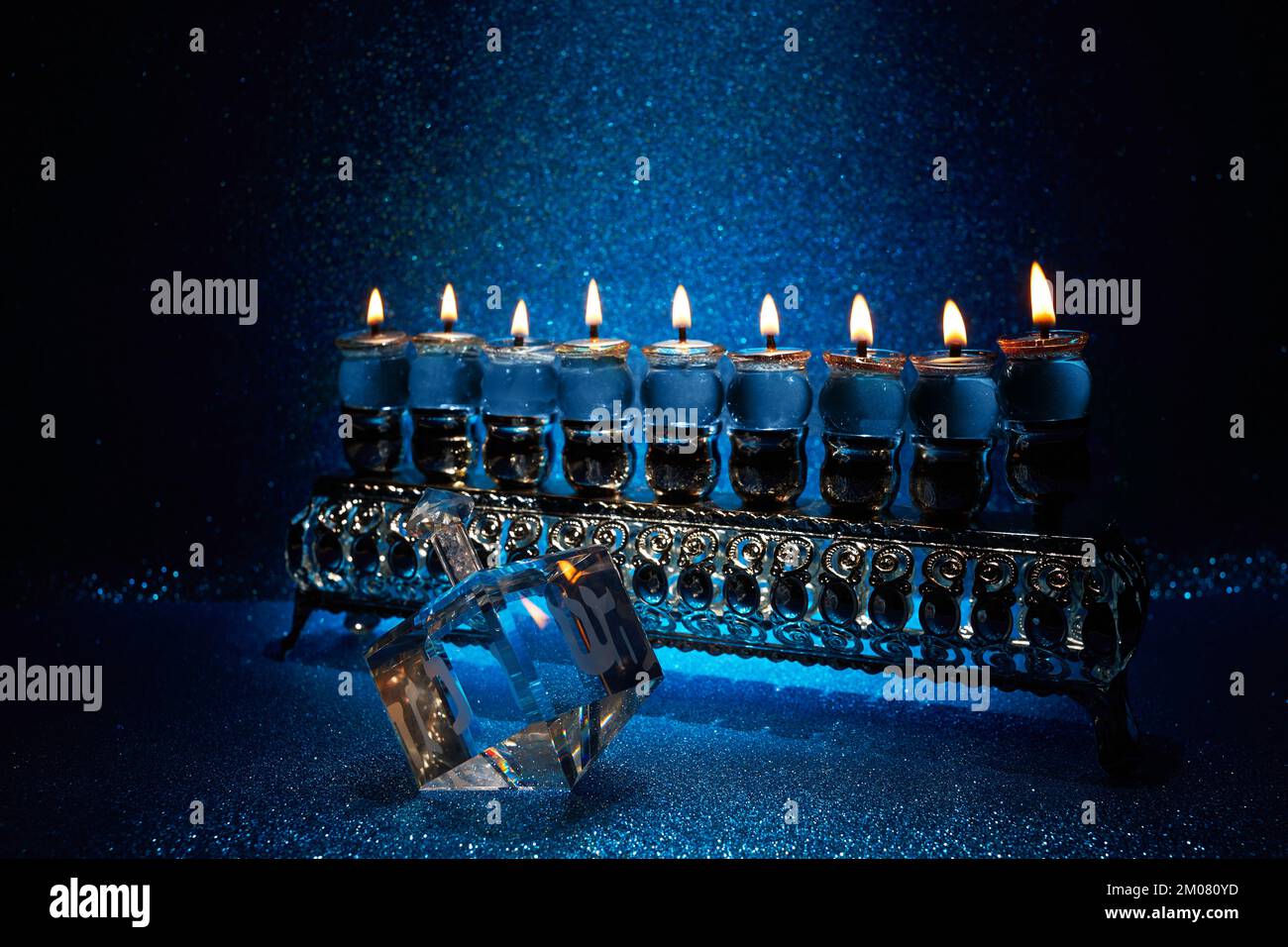 Jewish holiday Hanukkah background with menorah and dreidel with