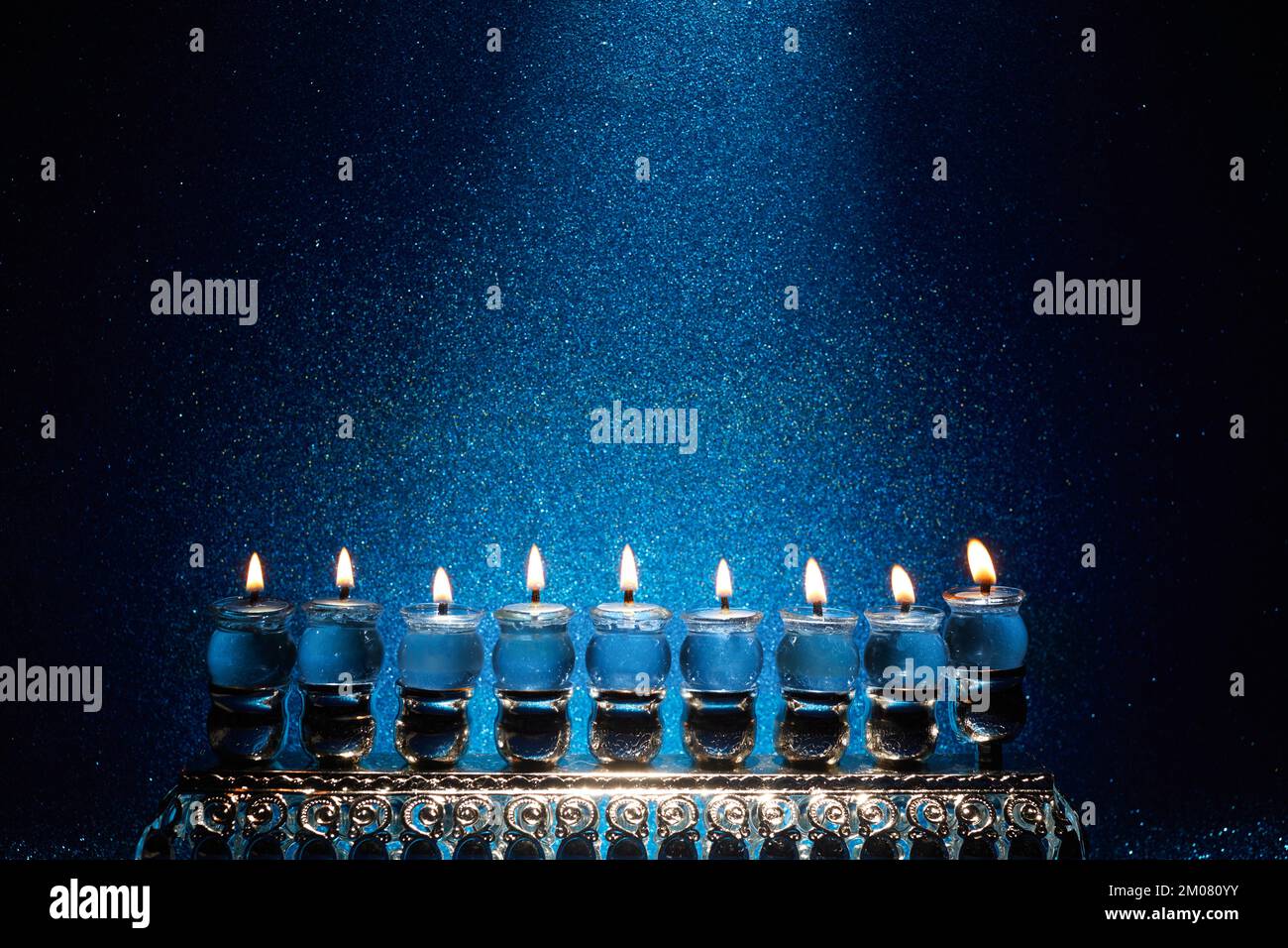 Jewish holiday Hanukkah background with menorah traditional candelabra