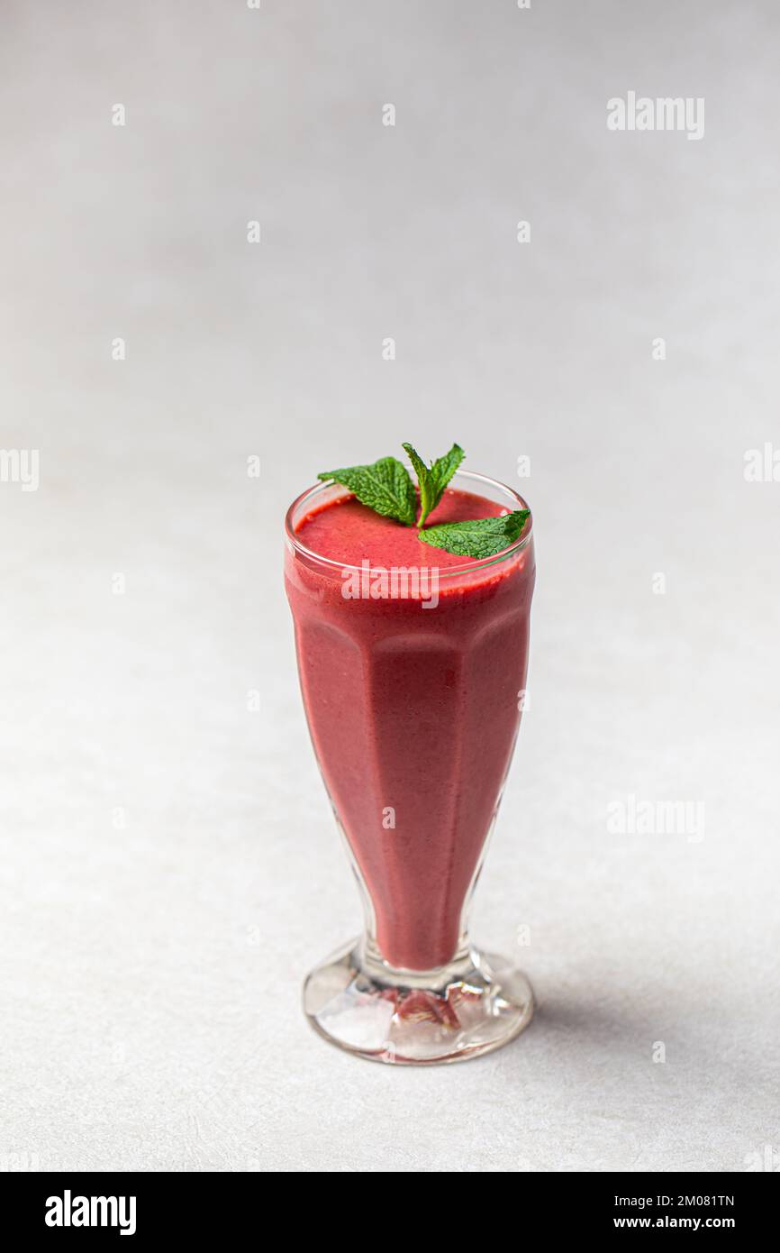 Glass of fresh berry smoothie with mint Stock Photo