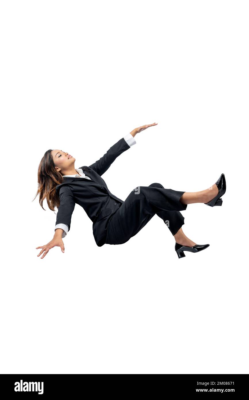 Asian businesswoman falling down isolated over white background Stock Photo