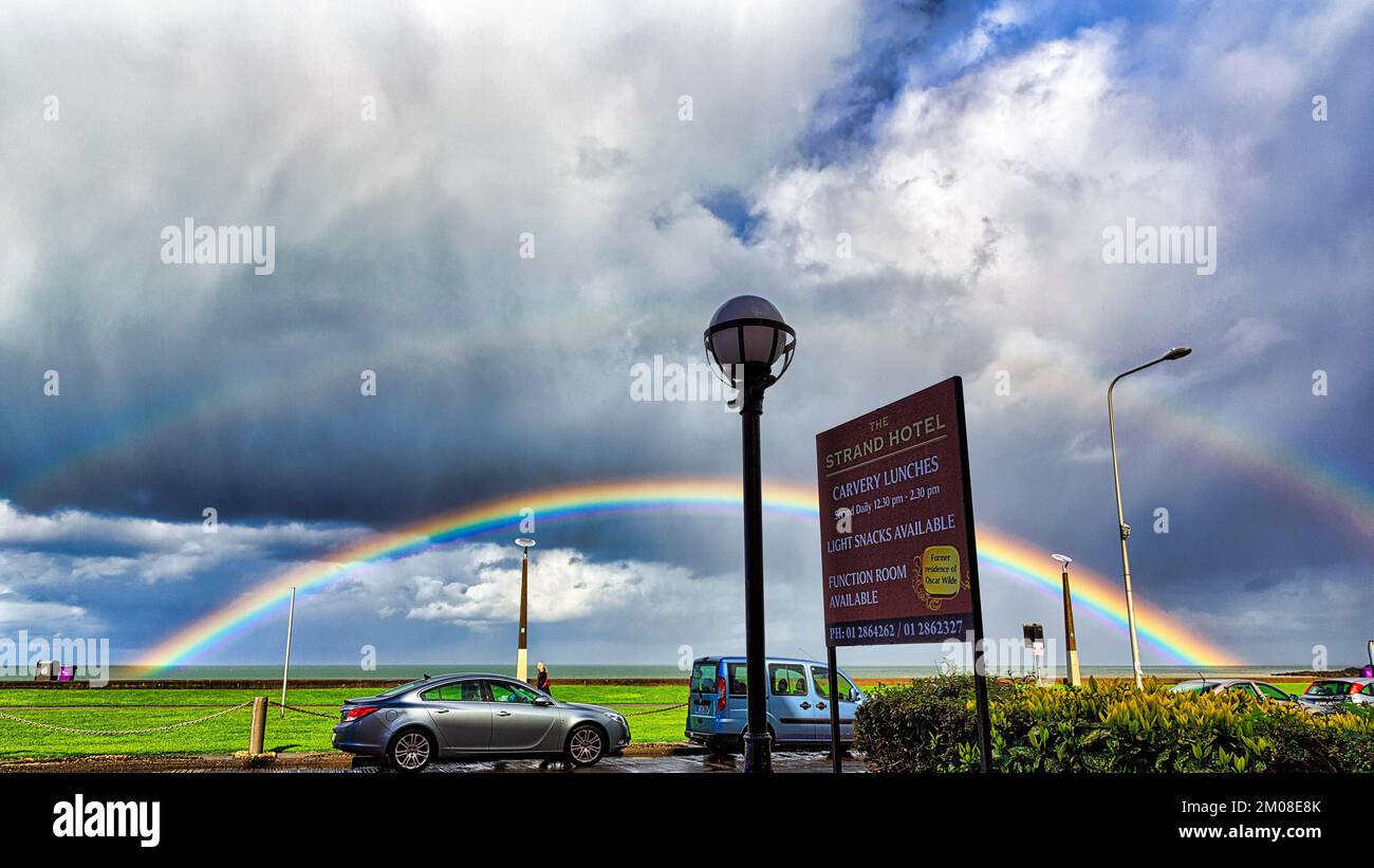 View of the coast road from the Strand Hotel, double rainbow in the cloudy sky, Bray, Wicklow, Ireland, Europe Stock Photo