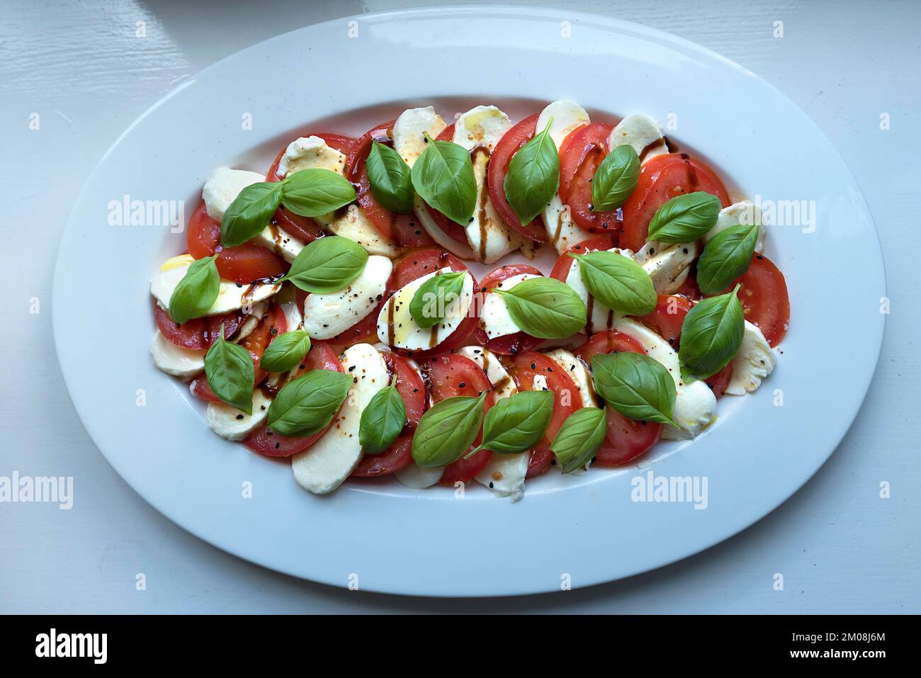 Tomato mozzarella on a plate, Lower Saxony, Germany, Europe Stock Photo