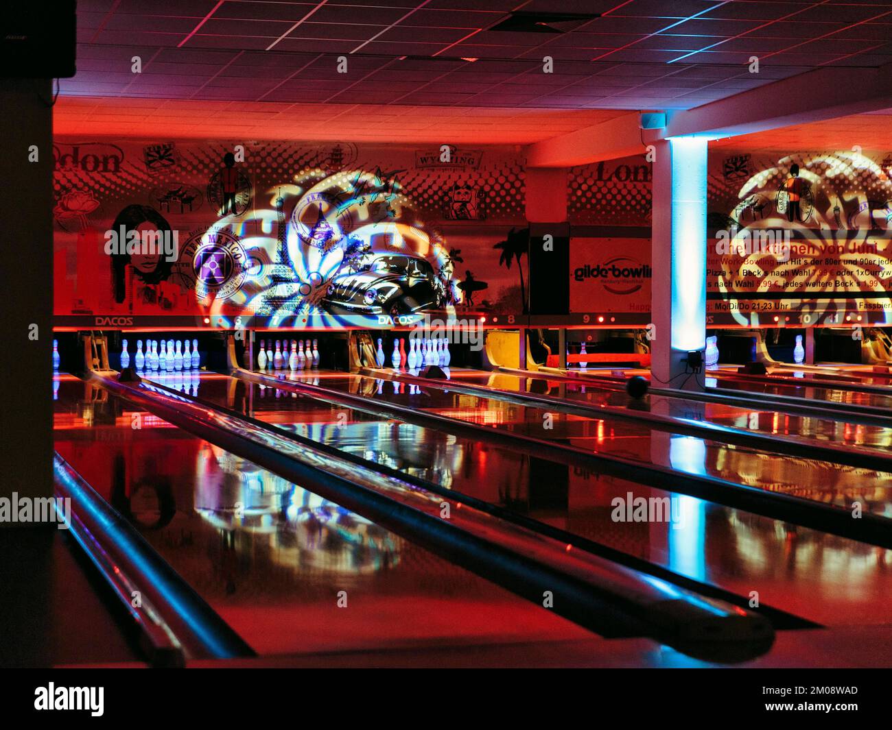 Colourfully illuminated bowling alley, bowling centre, interior