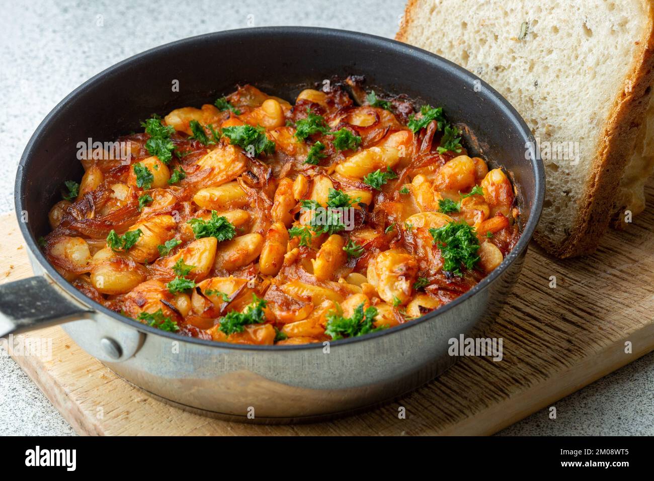 Prebranac a traditional Serbian dish of slow-cooked butter beans with caramelised onions Stock Photo