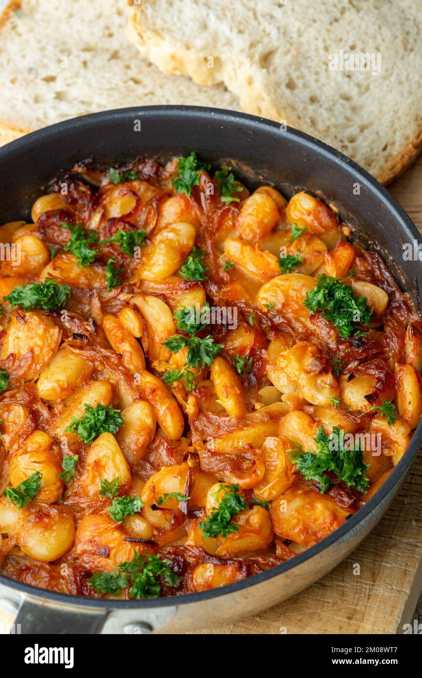 Prebranac a traditional Serbian dish of slow-cooked butter beans with caramelised onions Stock Photo