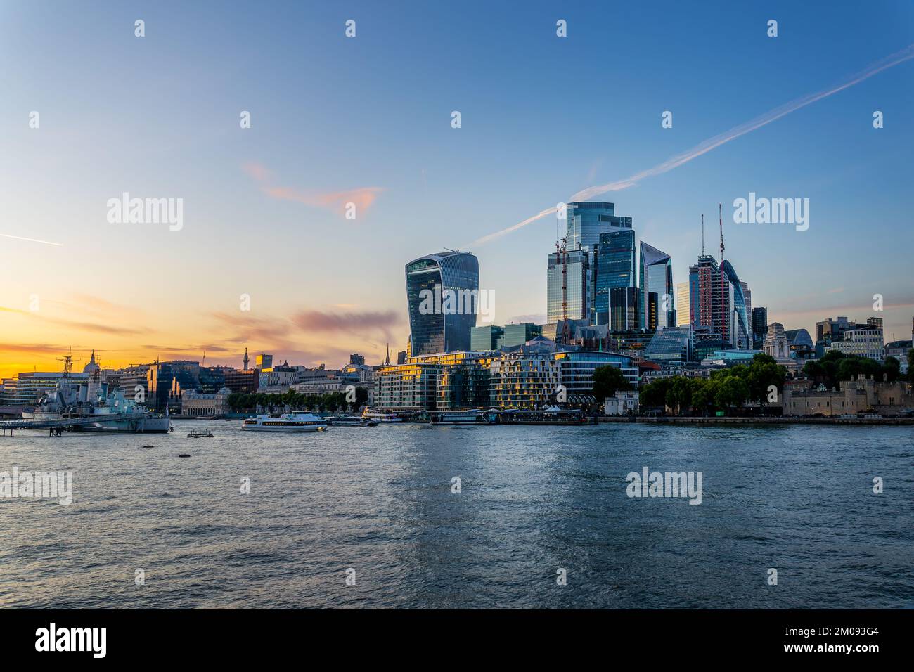 The City of London and the river Thames at sunset, in London, UK Stock Photo