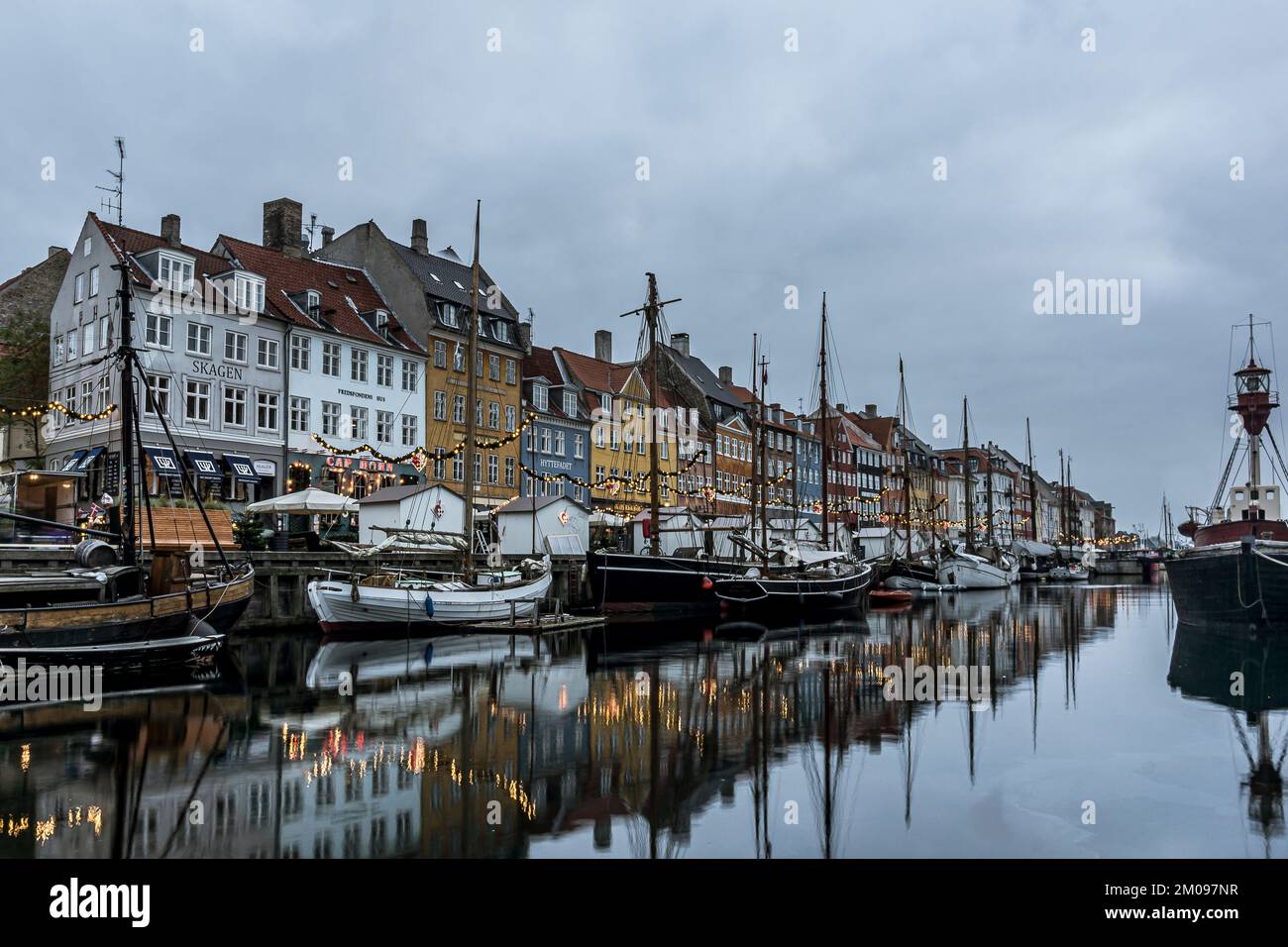 Christmas decorations reflecting in the water at Nyhavn canal in Copenhagen, November 9, 2017 Stock Photo