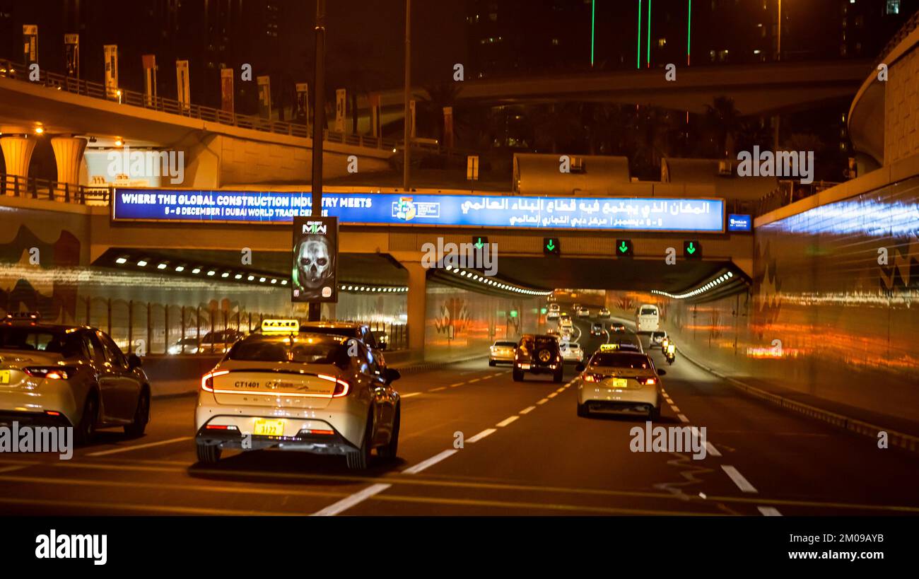 Dubai city in the night, road traffic in the night, high rise buildings ...