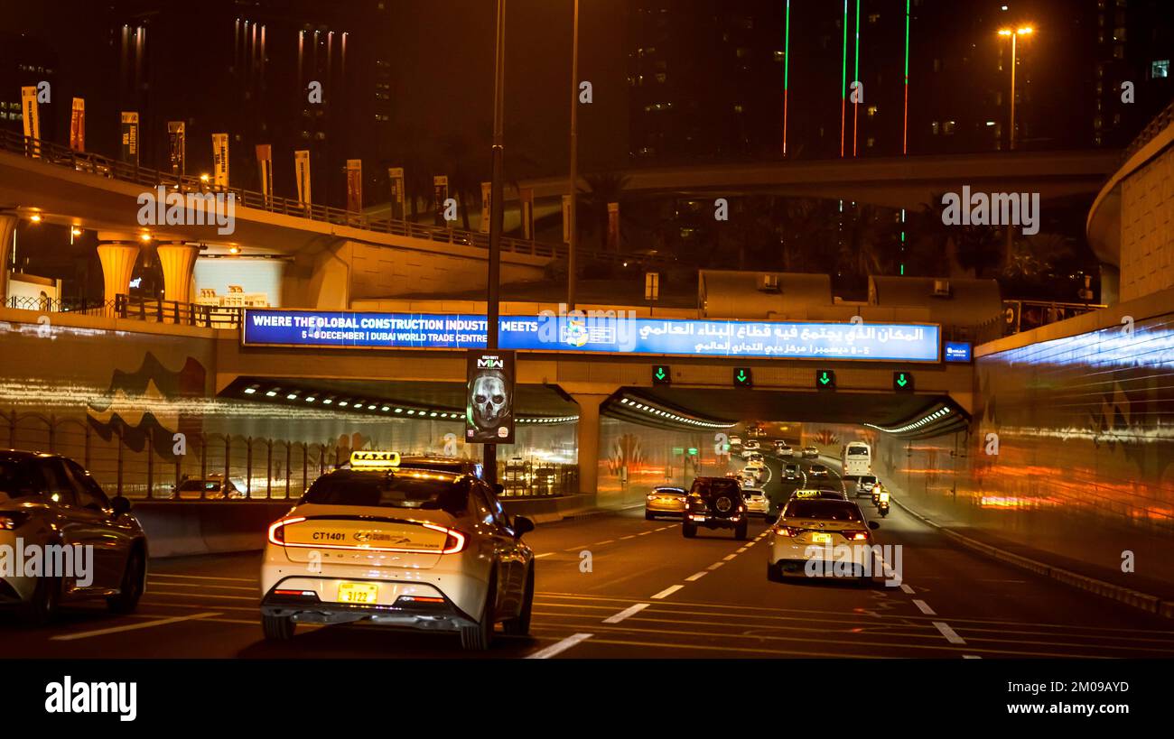 Dubai city in the night, road traffic in the night, high rise buildings ...