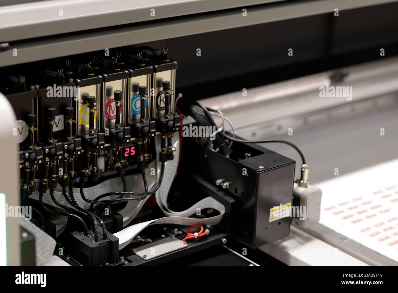 Printheads and ink supply system of large format inkjet printer. Selective focus. Stock Photo