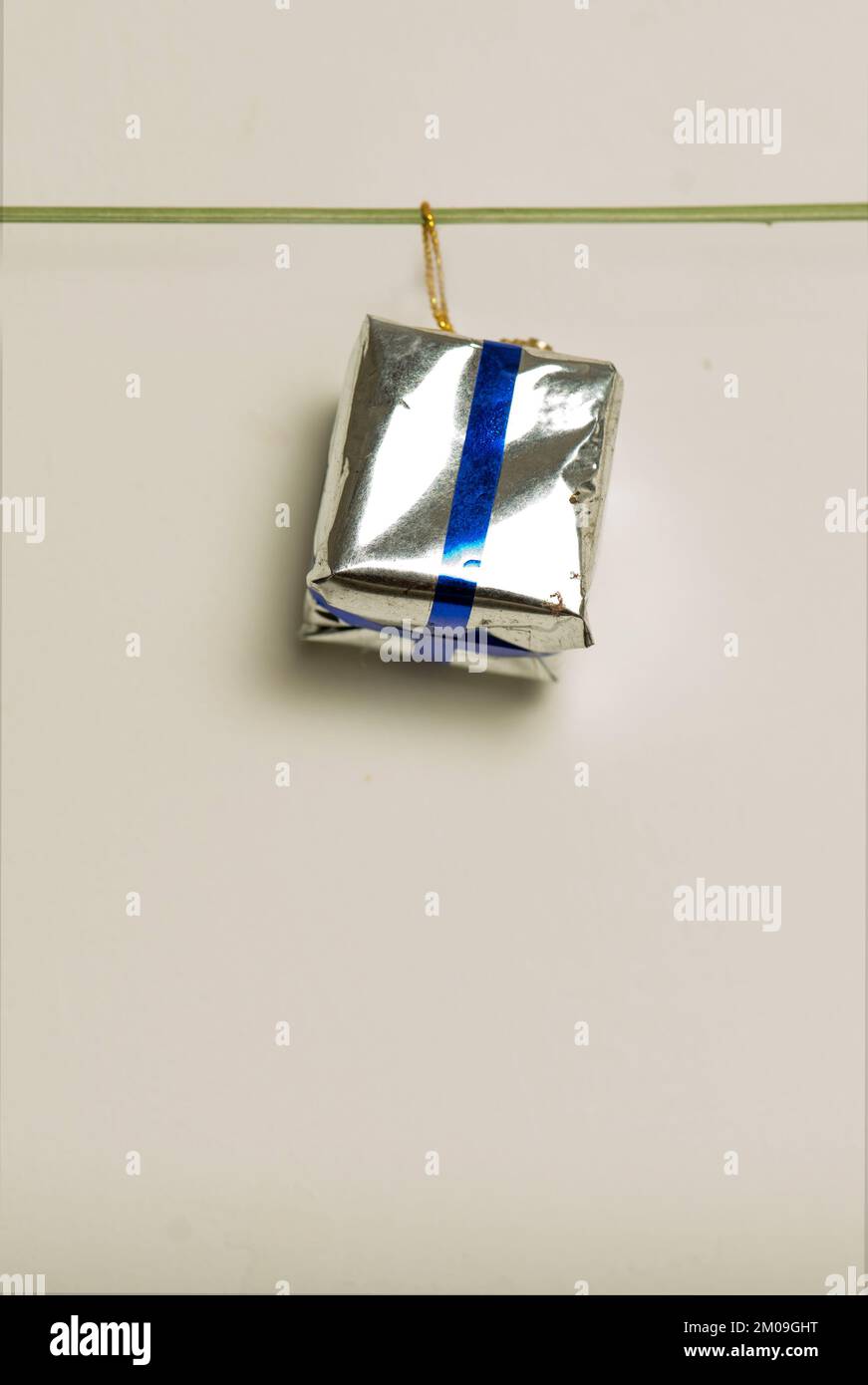 Christmas gift is isolated on grey background Stock Photo