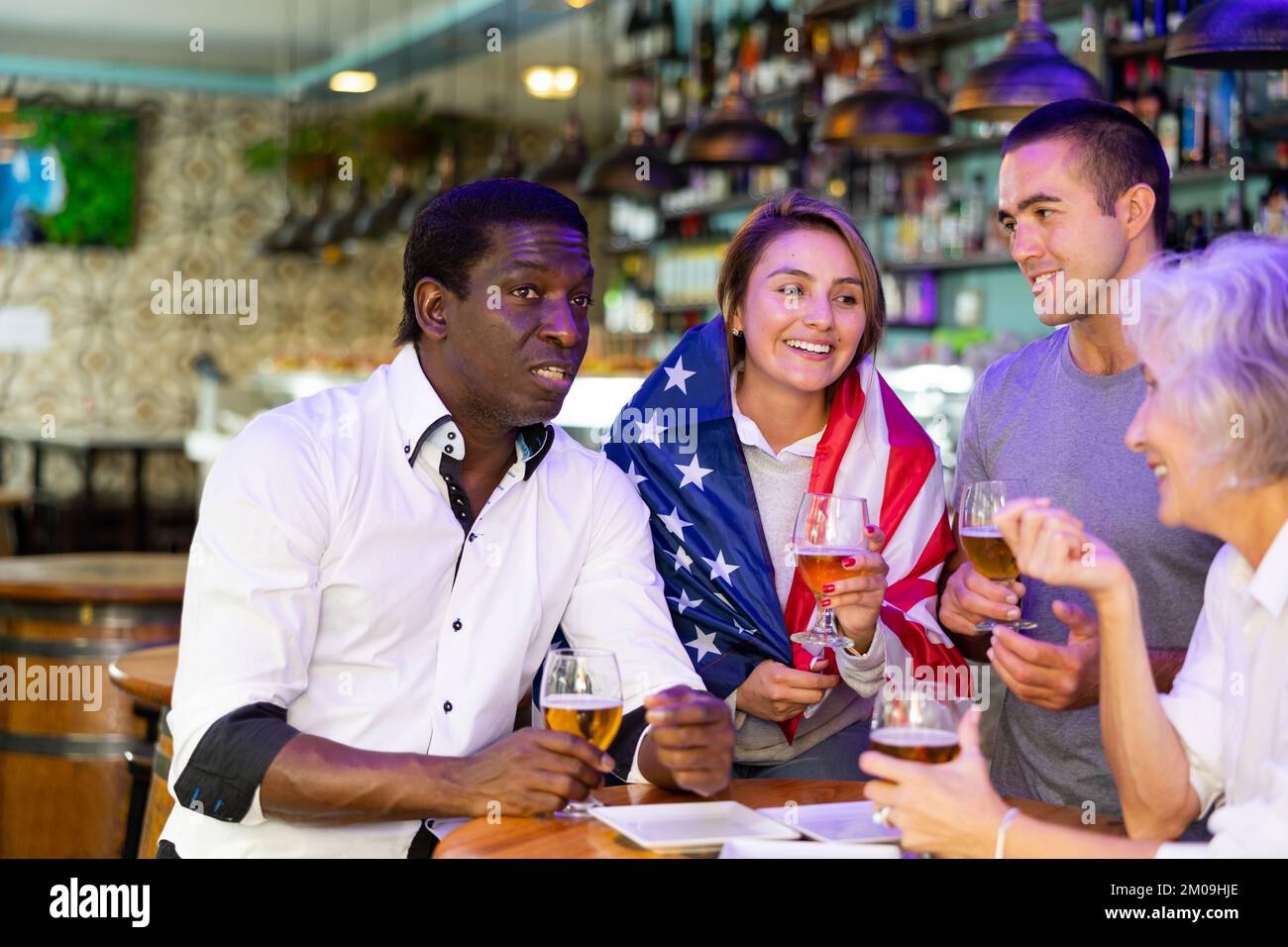 Man and woman drinking alcohol and having conversation on party in ...