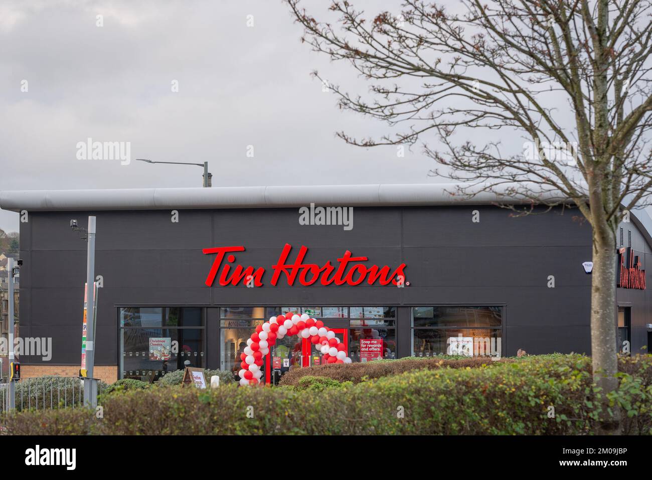 Burnley Lancashire. Taken on 5 December 2022. The new Tim Hortons building. Red and white balloon arch on the opening of the new building. Stock Photo