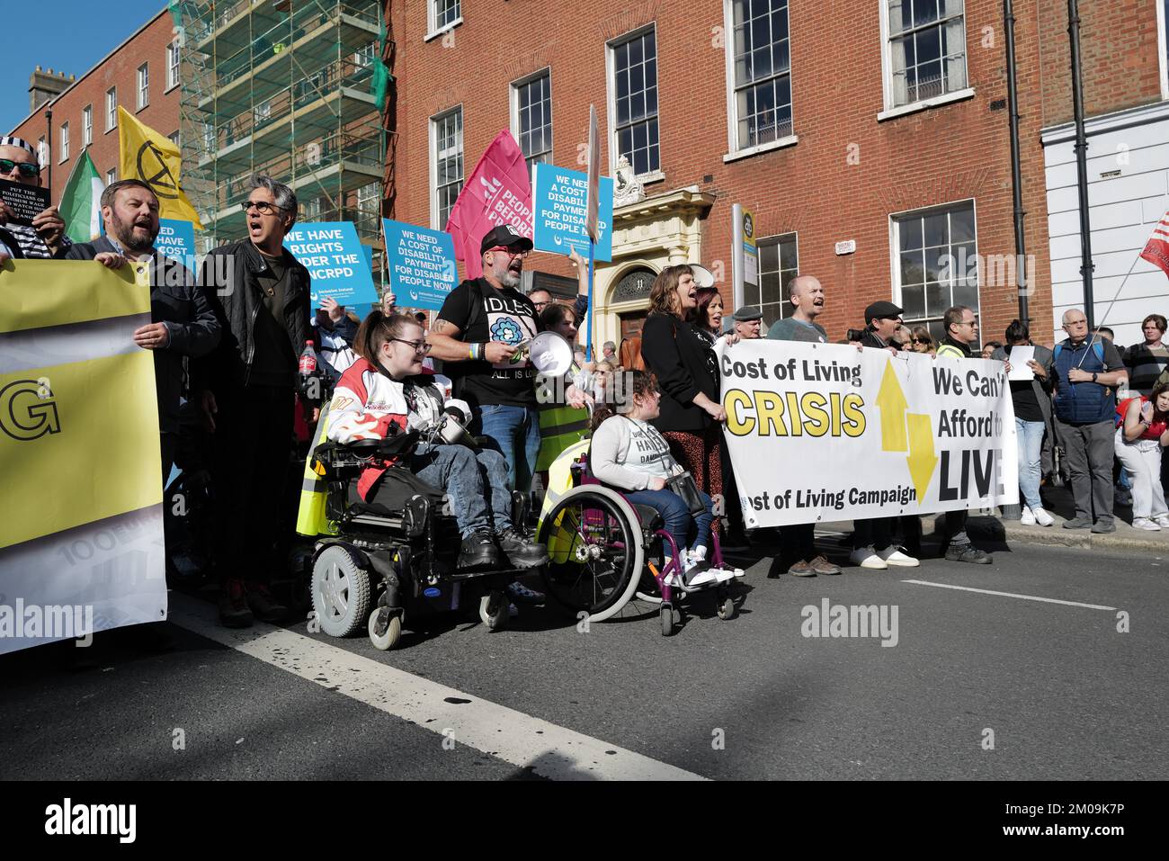 Protestors carrying placards and banners at a Cost of Living Crisis