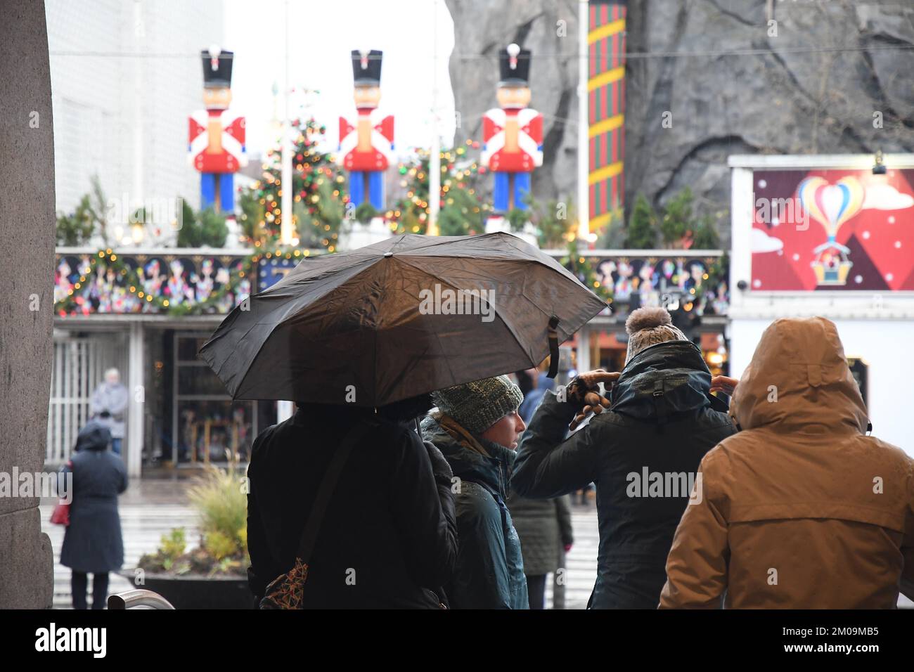 Copenhagen/Denmark/05 December 2022/ People under umbrella due to overy