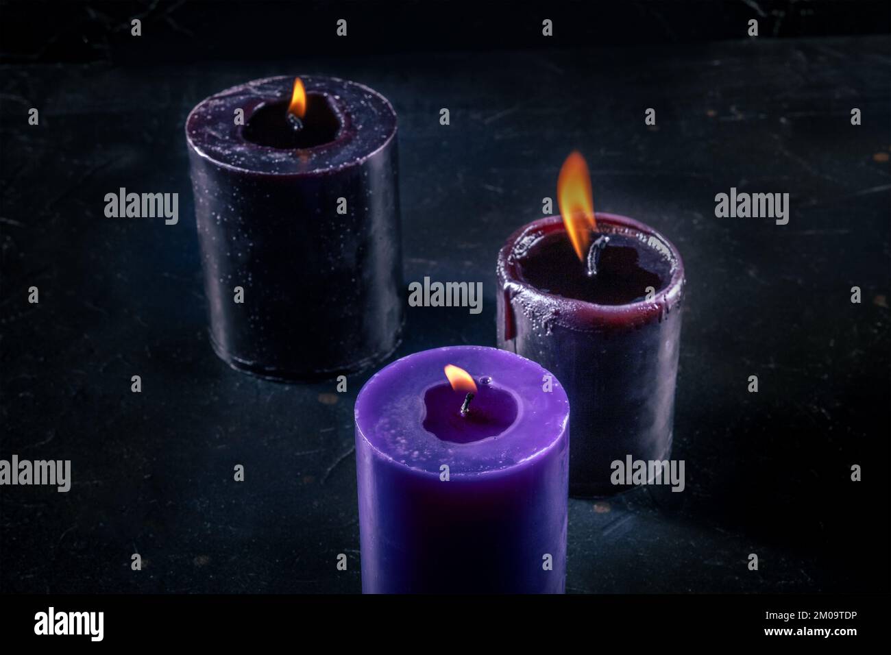 Burning candles on a dark background, mysterious ritual Stock Photo - Alamy