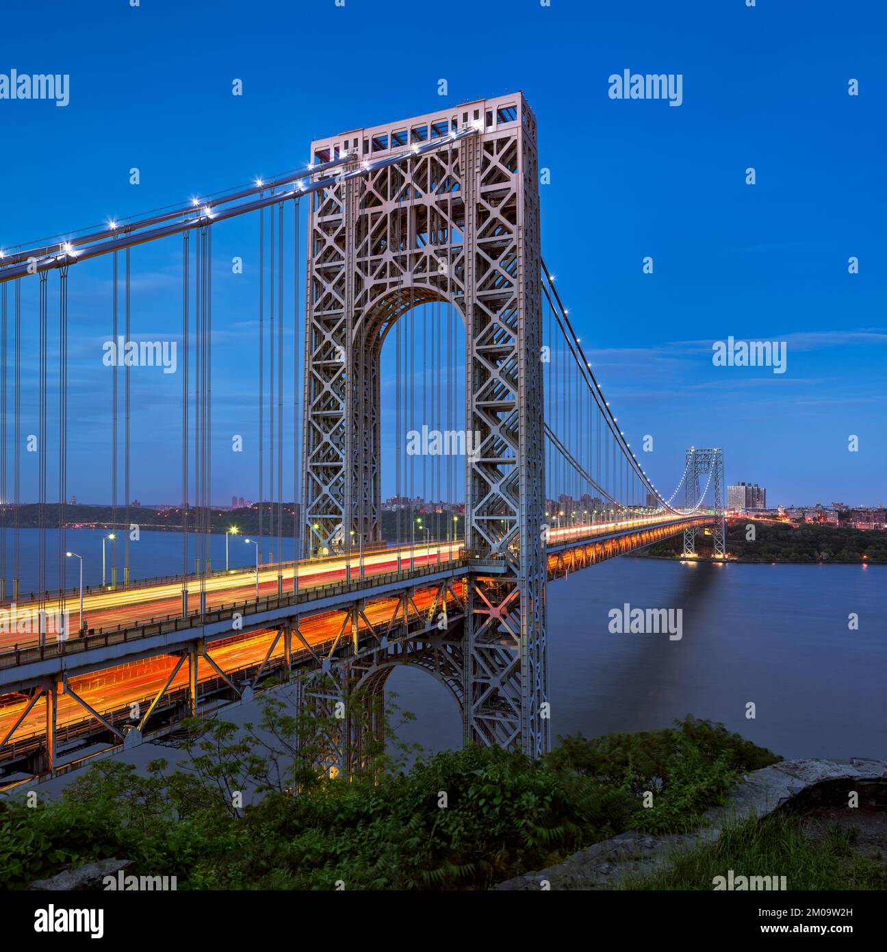 The George Washington Bridge across the Hudson River in evening connecting New Jersey with Upper Manhattan, New York City. USA Stock Photo