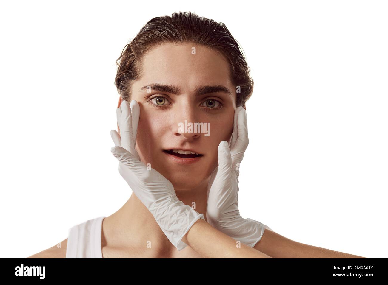 Portrait of young man visiting cosmetologist, taking care after skin