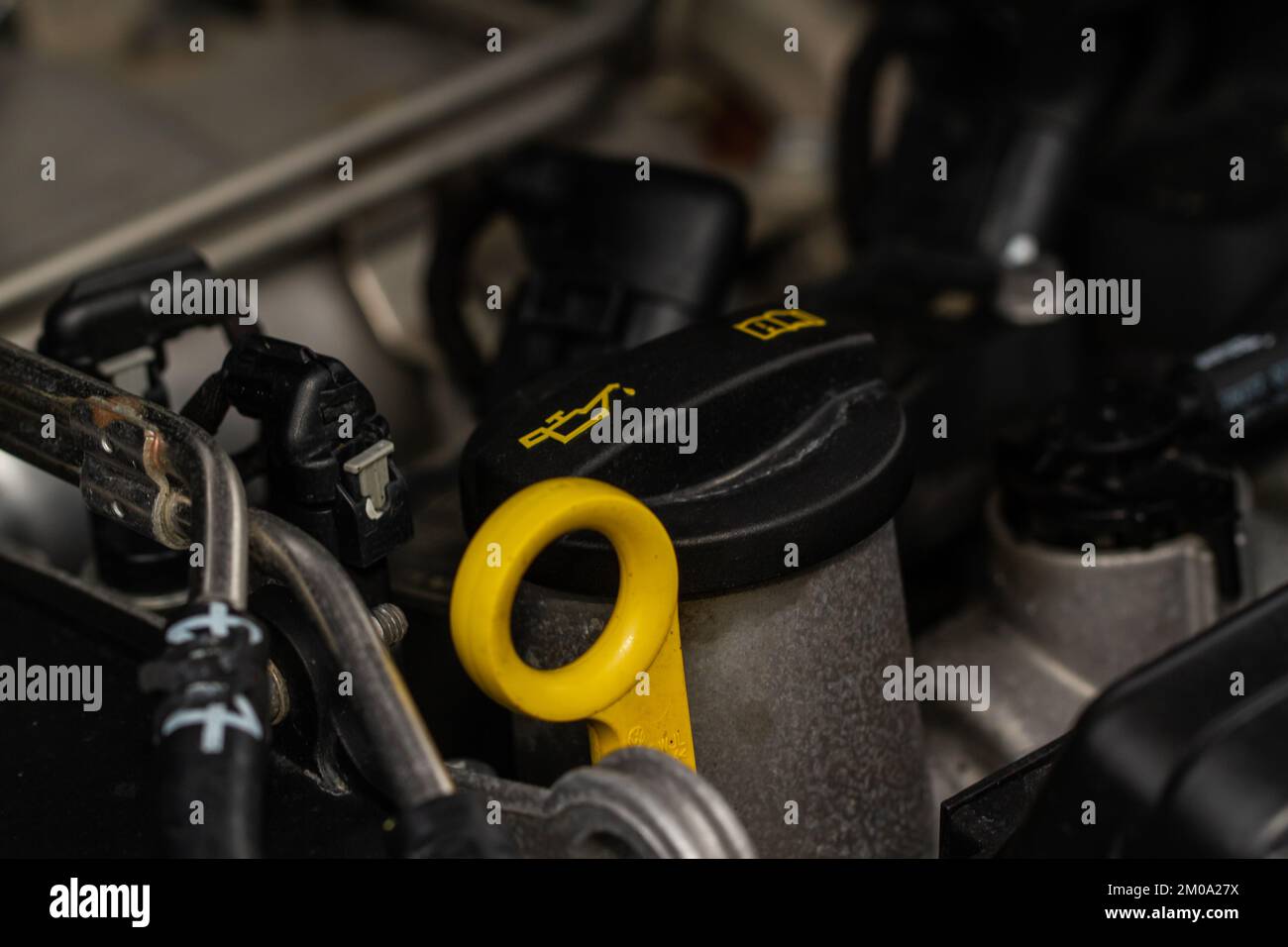 Closeup oil cap in engine room of a modern car. Oil cap on the car
