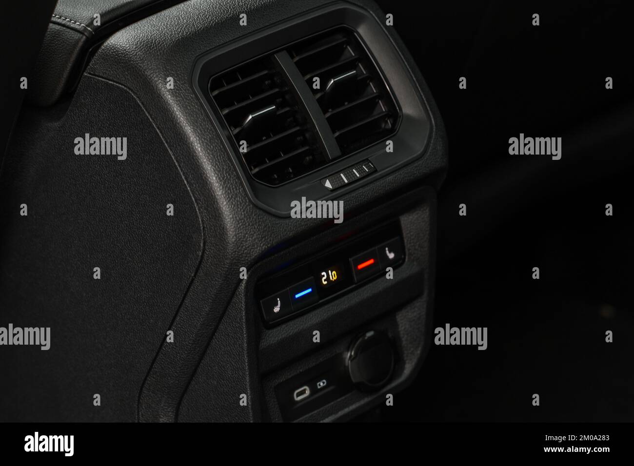 Car air conditioning buttons close up view inside a car. Car temperature conditioner dashboard