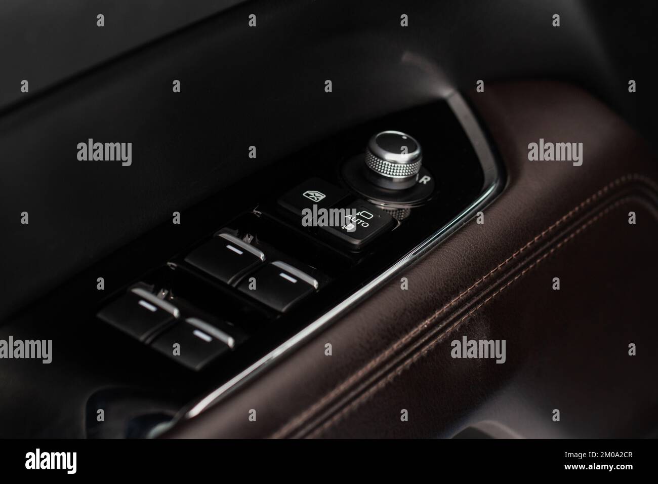 Side mirrors control panel on side door. Stock Photo
