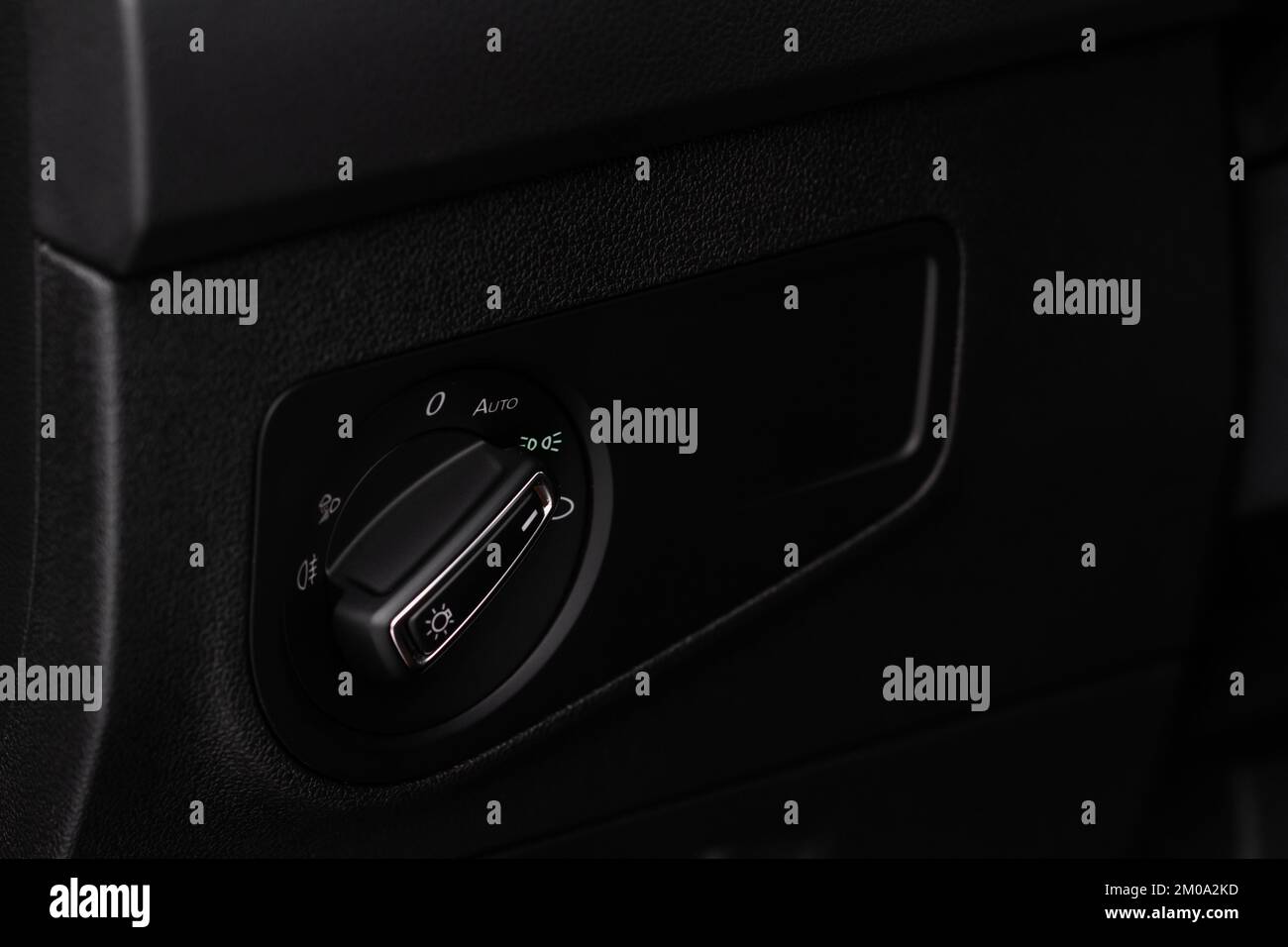 Closeup of the headlight switch control button. Lights control panel in car Stock Photo