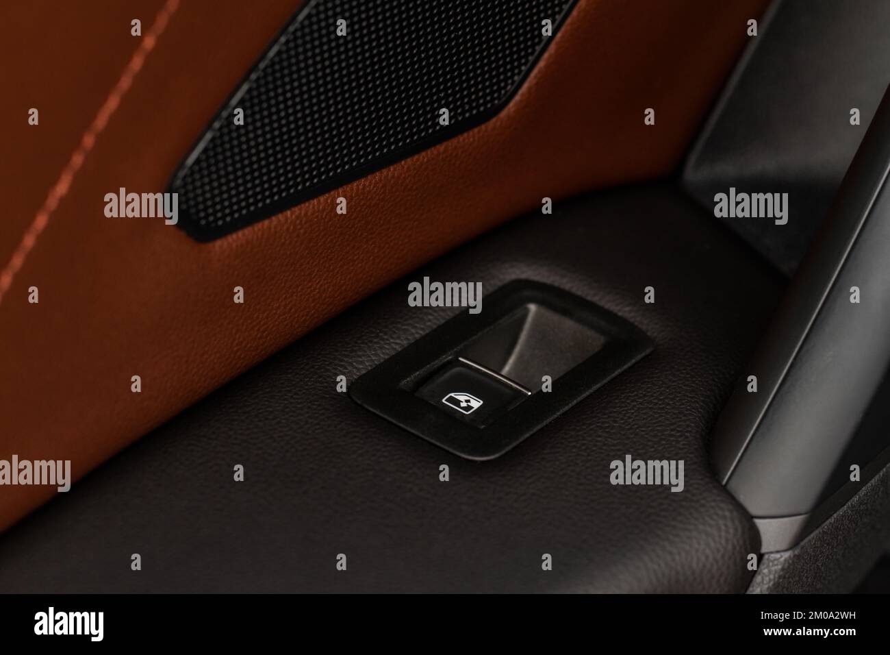 Close up view of button controlling window in modern car interior ...