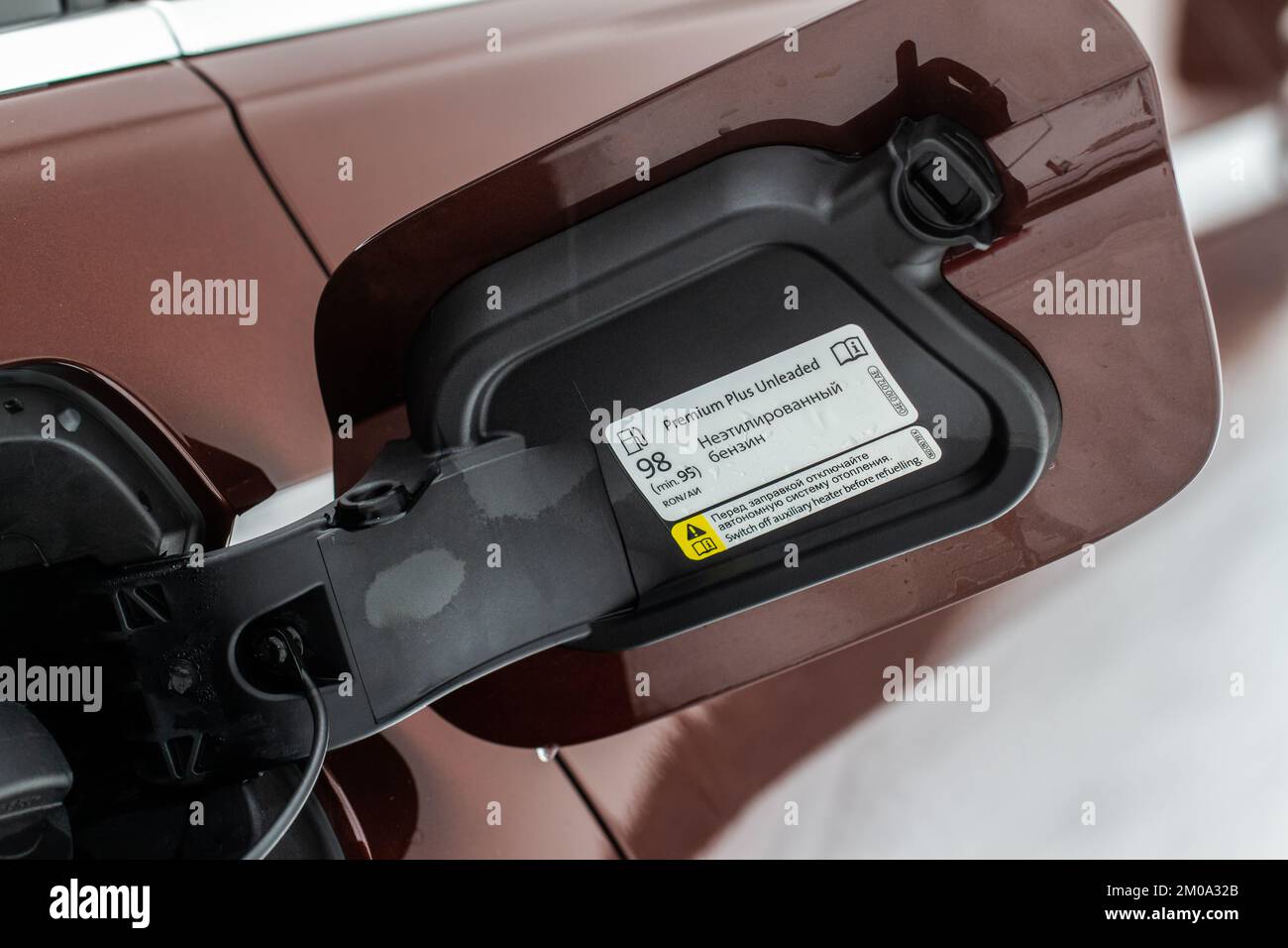 Exterior of car with fuel filler door open. Opened fuel tank cap of a car for filling gasoline