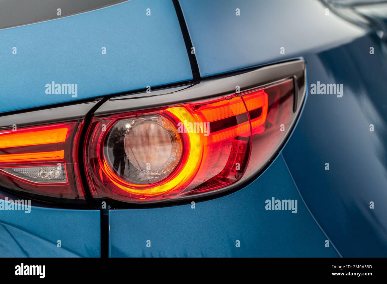 Modern rear light of a car. Brake light and arrow of large suv. Rear light of car close up view