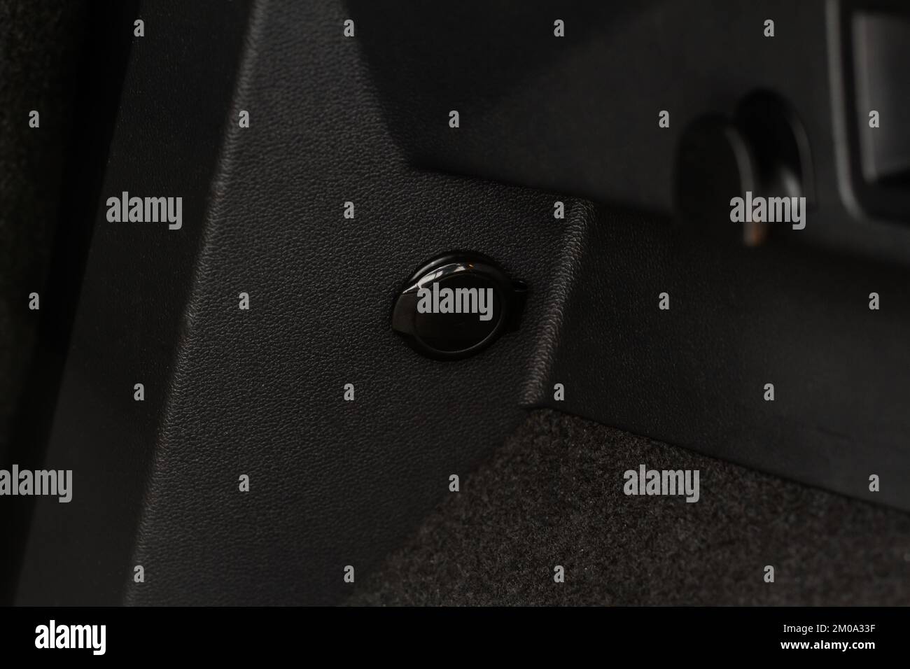 Modern car outlet socket. Closed 12V power outlet socket Stock Photo