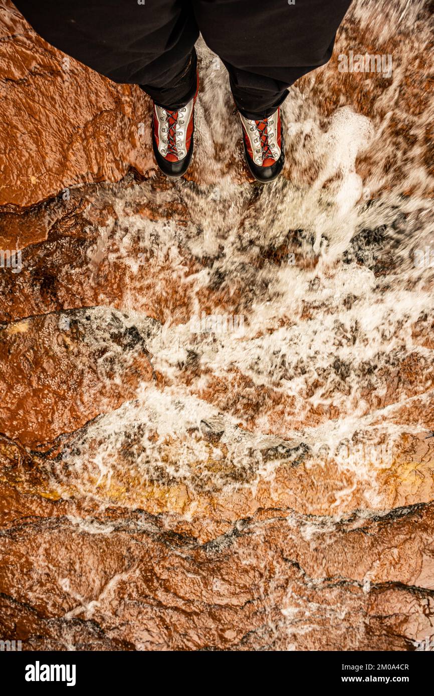 Looking Down At Canyoneering Boots In Rushing Creek in Zion National