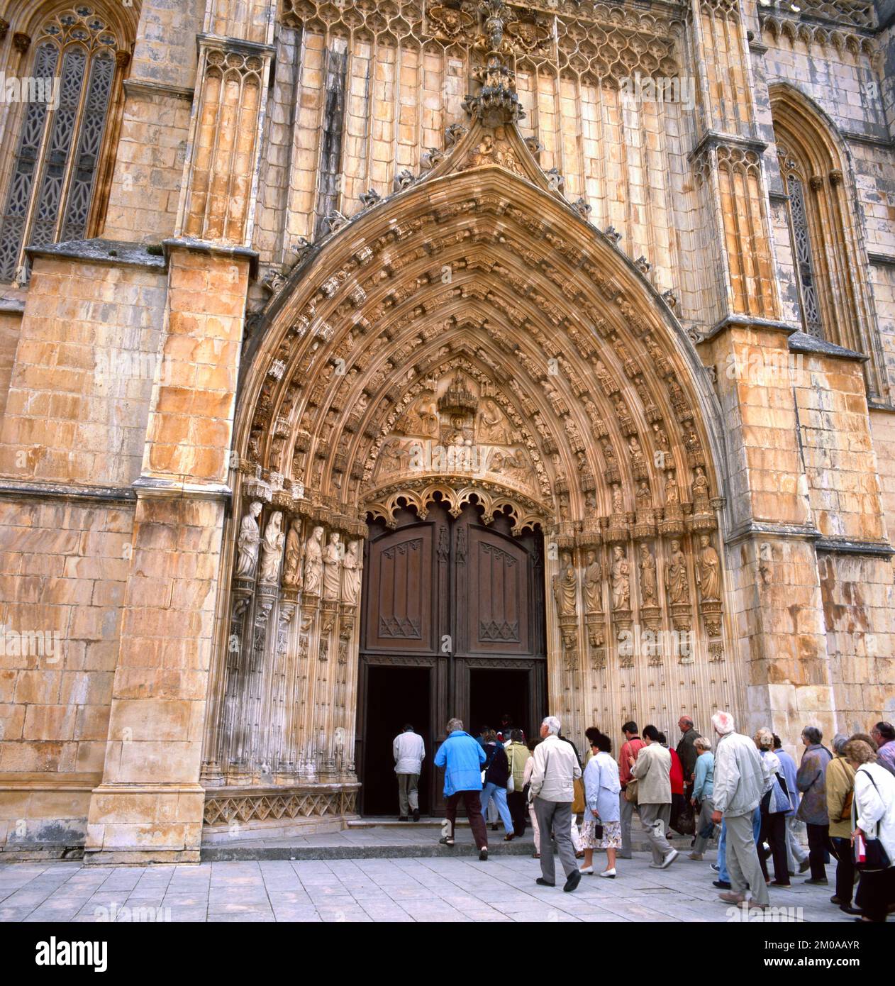 BATALHA,PORTUGAL-APRIL 08, 2022:The main portal of the monastery of Batalha, Mosteiro de Santa Maria da Vitoria, listed as UNESCO world heritage site. Stock Photo