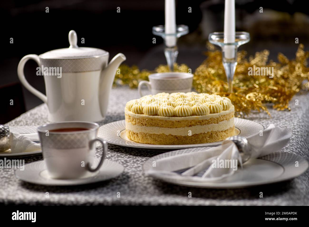 Festive served Christmas table with cake. Family tea party for