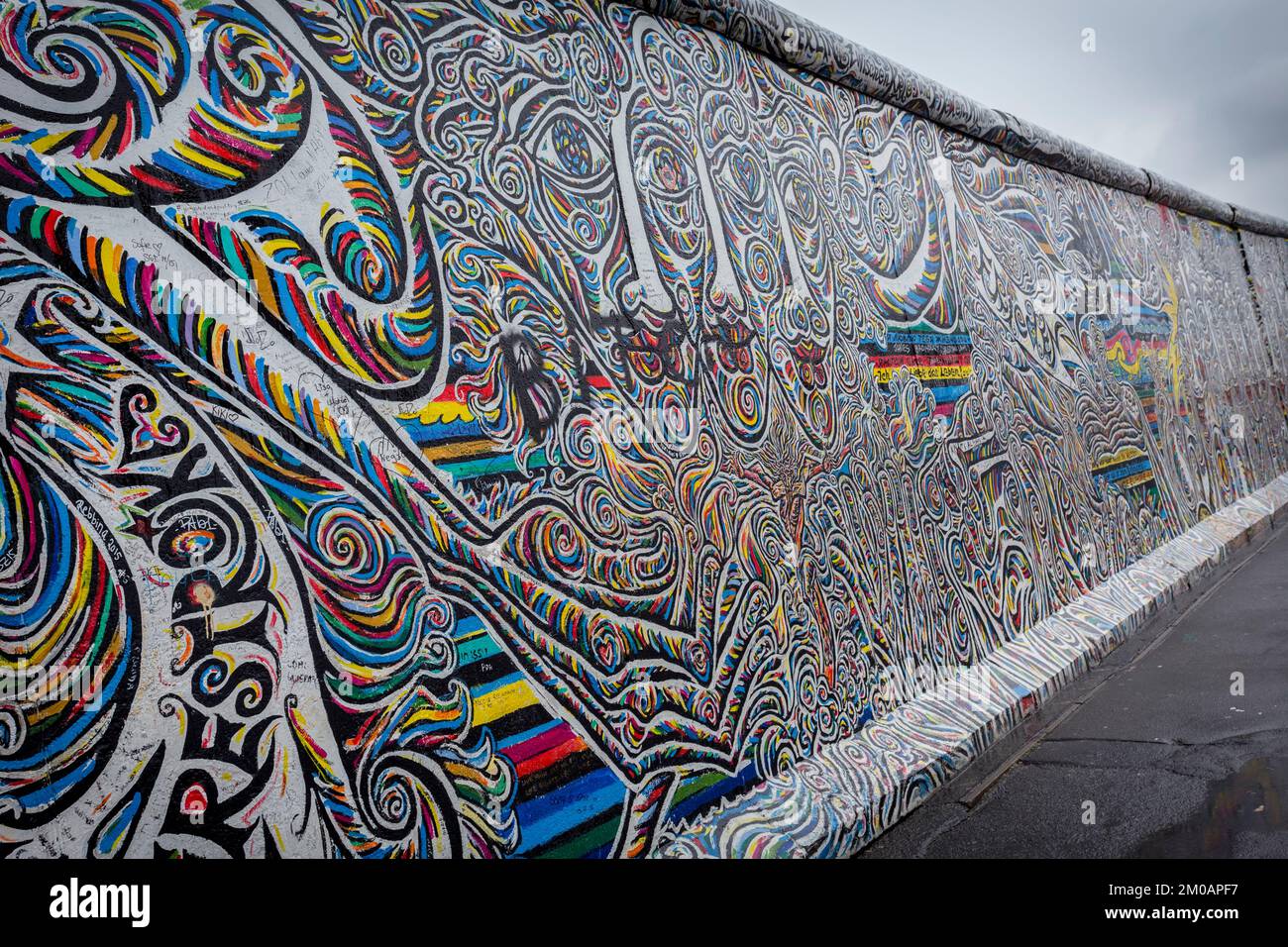 View of the graffiti on the famous remainings of the Berlin Wall of East Side Gallery, Kreuzberg, Berlin, Germany. Stock Photo