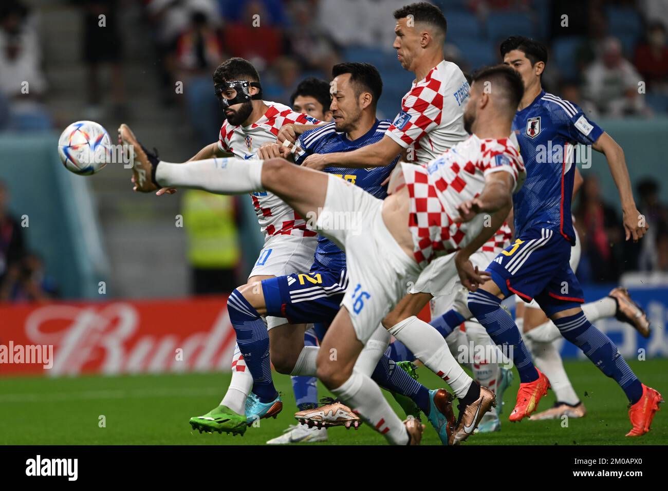 Al Wakra, Qatar. 05th Dec, 2022. Soccer, World Cup, Japan - Croatia, final round, round of 16, Al-Janub Stadium, Croatia's Ivan Perisic and Japan's Maya Yoshida in duel. Credit: Robert Michael/dpa/Alamy Live News Stock Photo