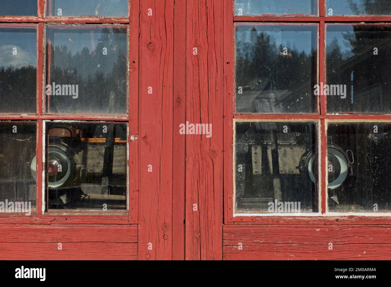 Red painted doors with glass windows to old locomotive garage Stock ...