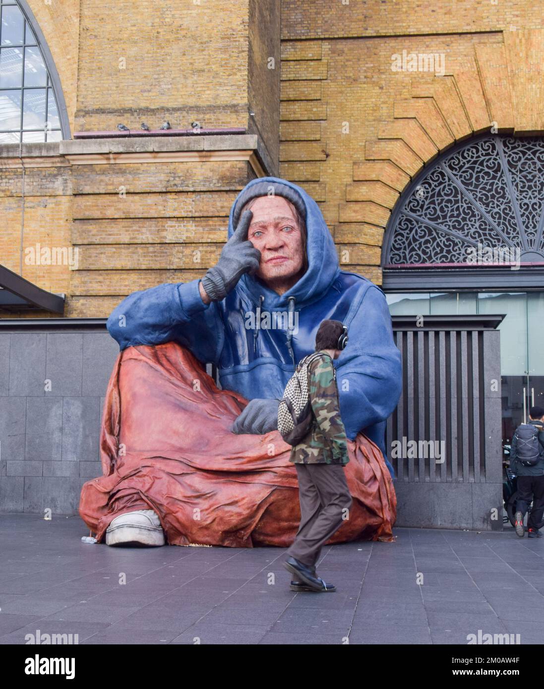 london-uk-5th-december-2022-a-giant-sculpture-of-a-homeless-person