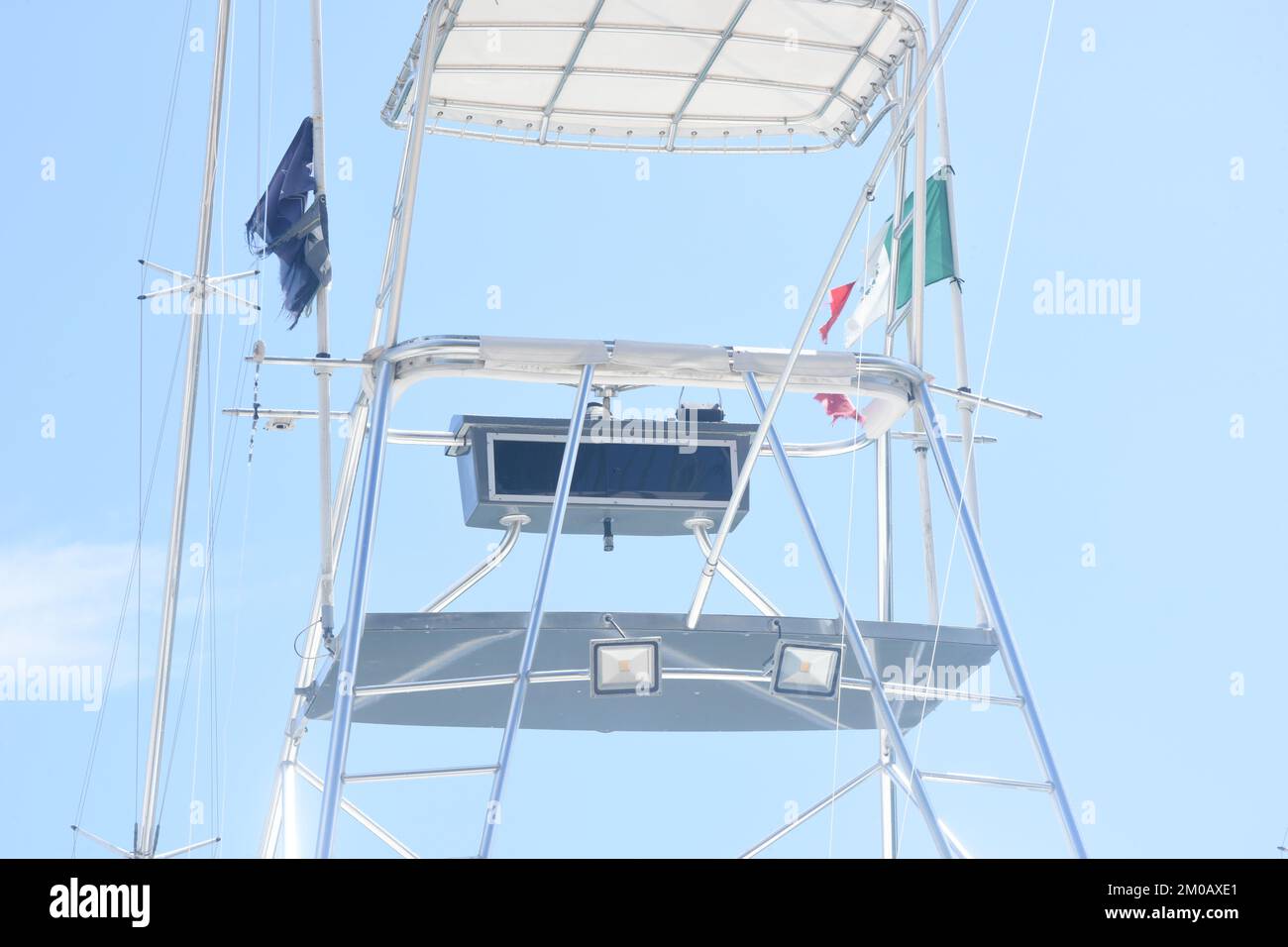 The tuna tower or flybridge is used to control a fishing boat while sailing in the open sea Stock Photo