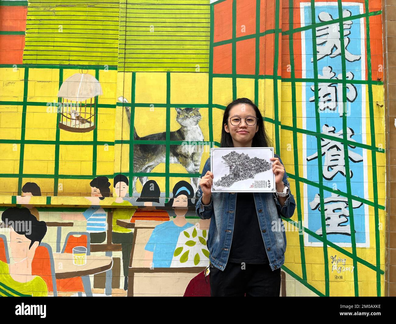 Hong Kong artist Lamcat Lam Suet-ying created an ink wash painting that  features 54 stores and landmarks, paying tribute to the city's traditional  craftspeople. 23NOV22 SCMP / Kelly Fung Stock Photo - Alamy