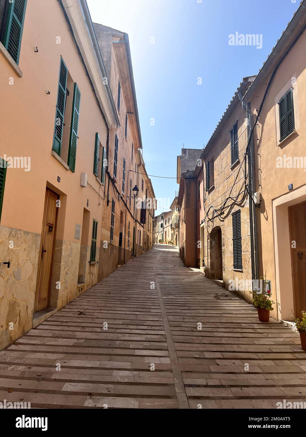 A vertical shot of an inclined narrow street Stock Photo - Alamy