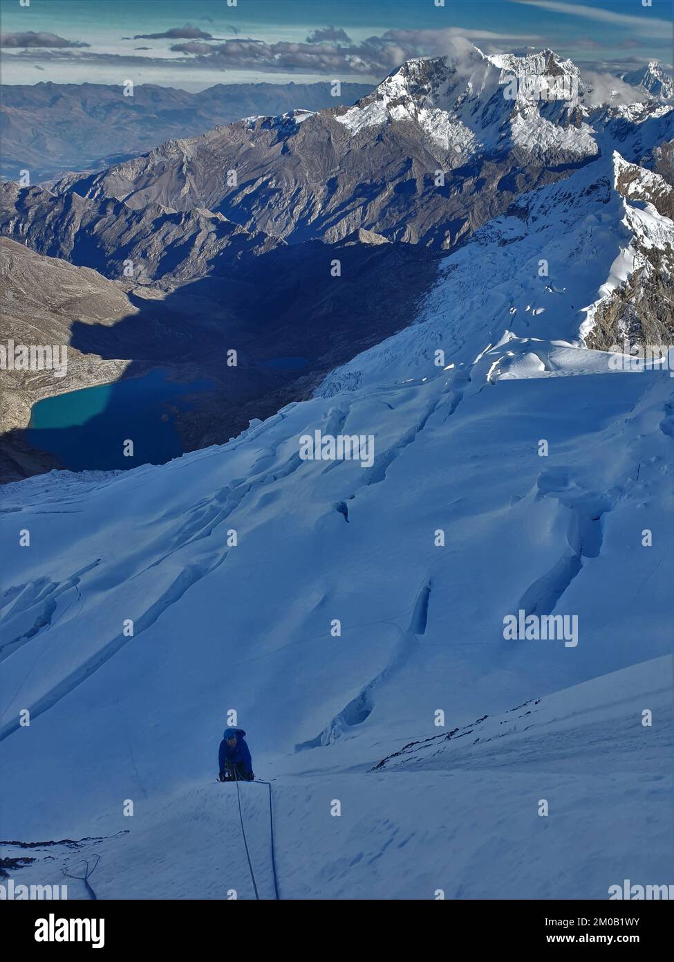 An alpinist climbing the snowy Yanapaccha mountain of the Cordillera