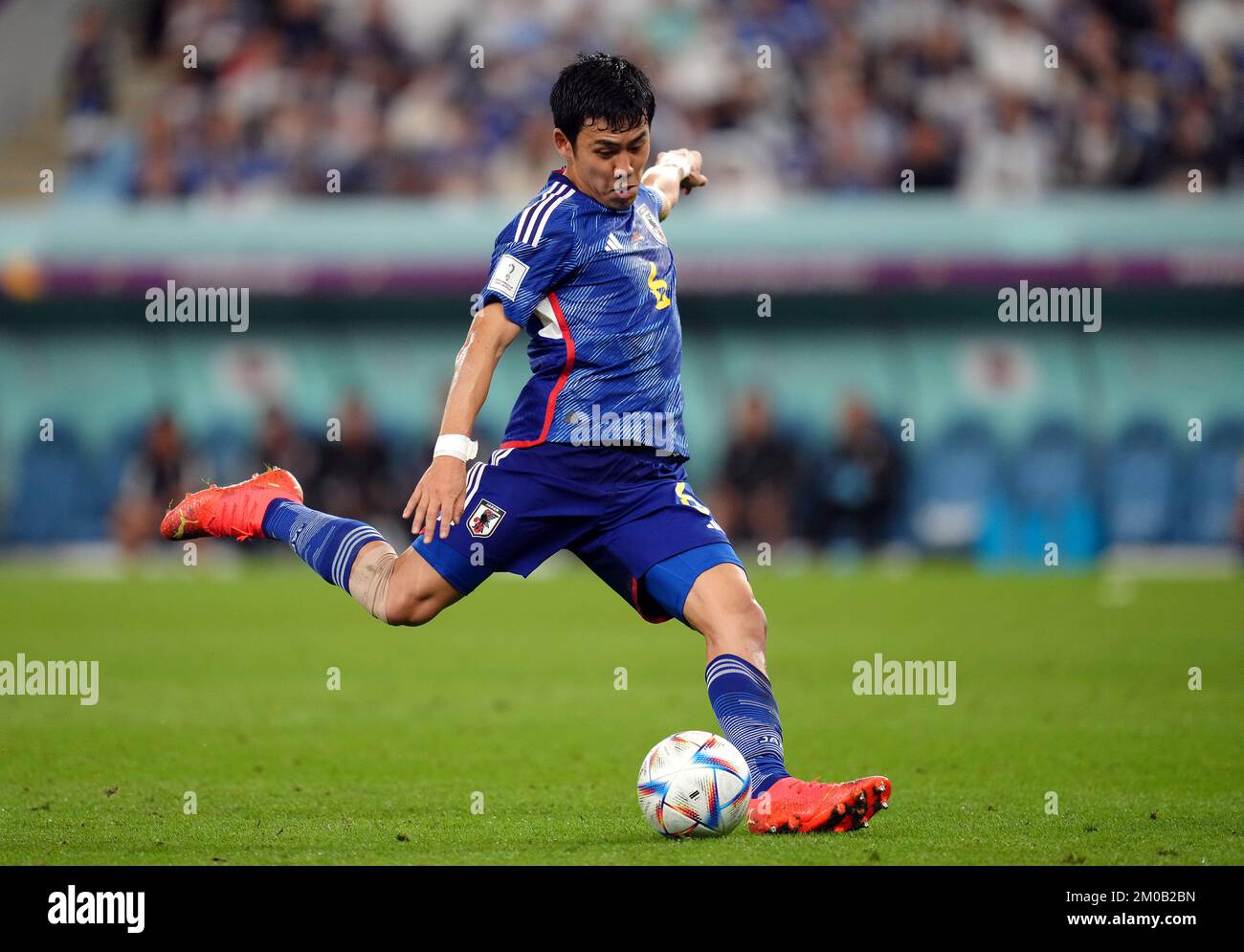 Japan’s Wataru Endo shoots during the FIFA World Cup Round of Sixteen match at the Al Janoub Stadium in Al-Wakrah, Qatar. Picture date: Monday December 5, 2022. Stock Photo