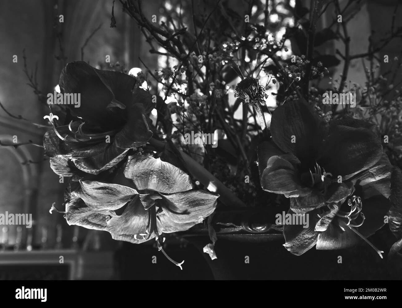 Mourning flowers in church. Black white photography Stock Photo