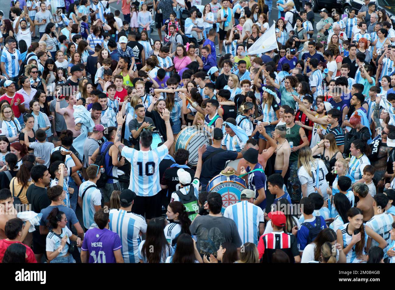 Buenos Aires, Argentina - December 4, 2022: Happy Argentine football fans celebrate winning a football match at the Qatar 2022 FIFA World Cup. High quality photo Stock Photo