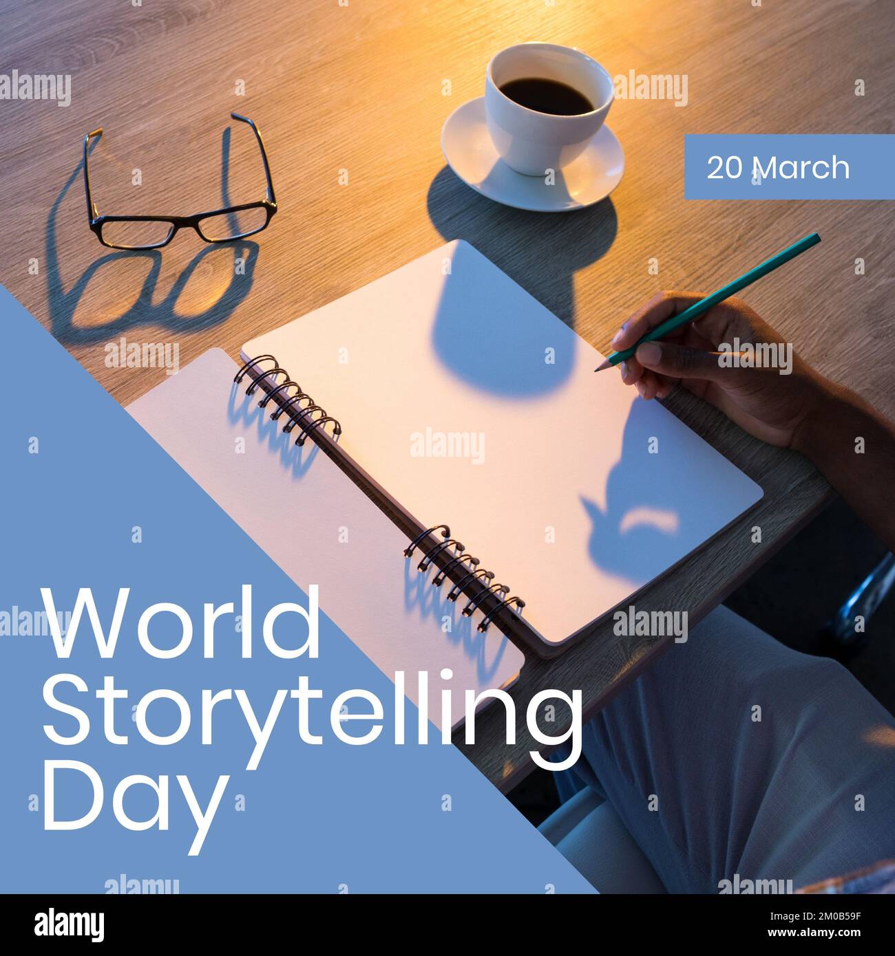 Composition of world storytelling day text with hand of man writing Stock Photo