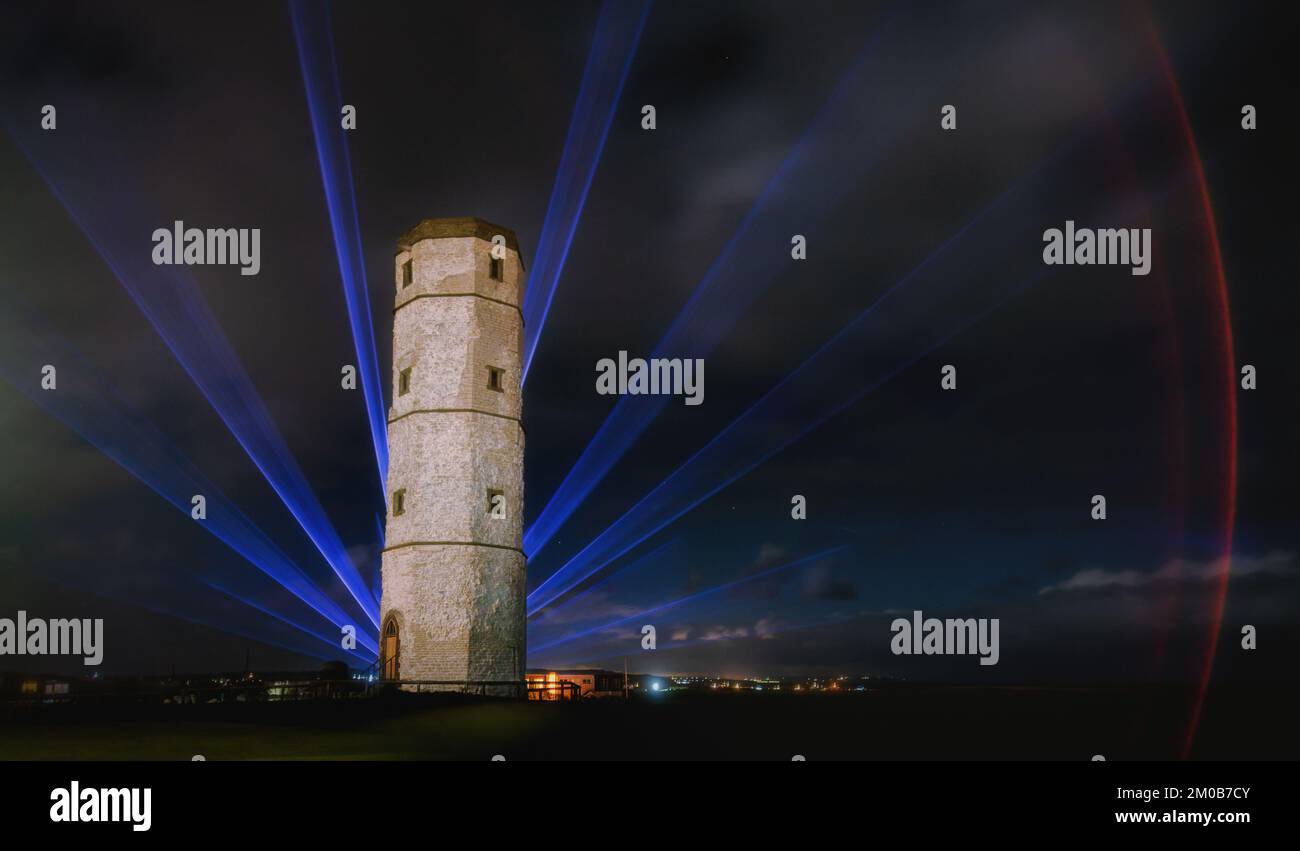 3 December 2022: Christmas laser light show (funded by the Yorkshire Coast BID) sees The Chalk Tower at Flamborough Head lit up in beautiful coloured lights (including 7pm until 9.30pm on December 9 and 10 2022) East RIding of Yorkshire, UK . Credit: Rebecca Cole/Alamy Live News Stock Photo