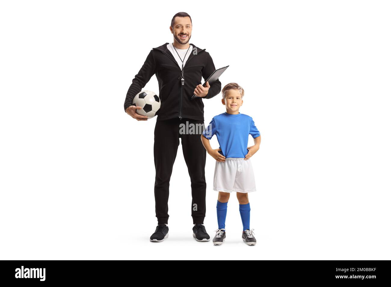 Boy in a jersey and a football coach posing isolated on white