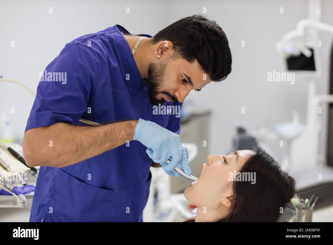 Happy patient and dentist concept. Young bearded asian male ...