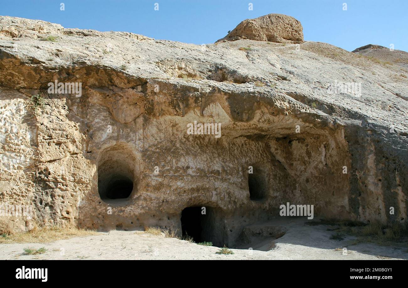 Takht-e Rostam (Takht-e Rustam) is a stupa monastery in northern Afghanistan. Entrance to the cave monastery with rooms inside. Stock Photo